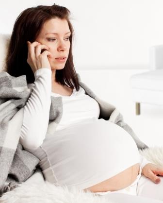 Pregnant woman with mobile phone